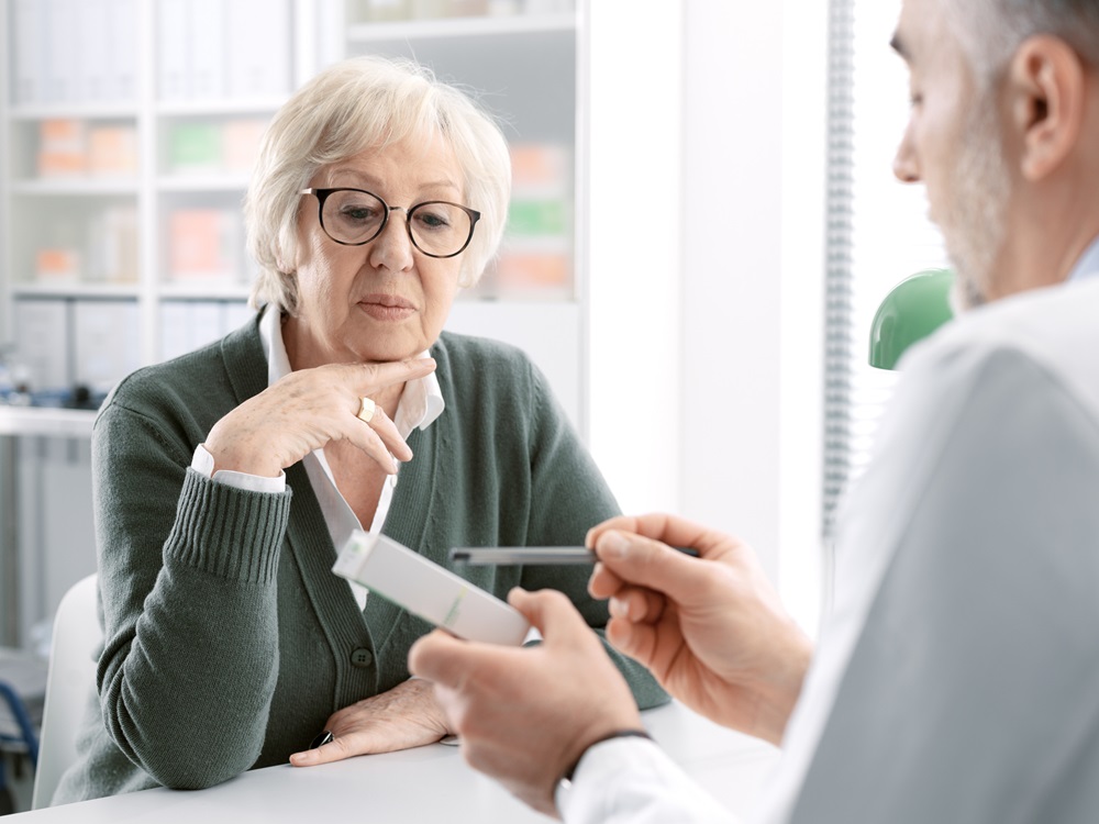 Apotheker heeft begeleidingsgesprek met patient